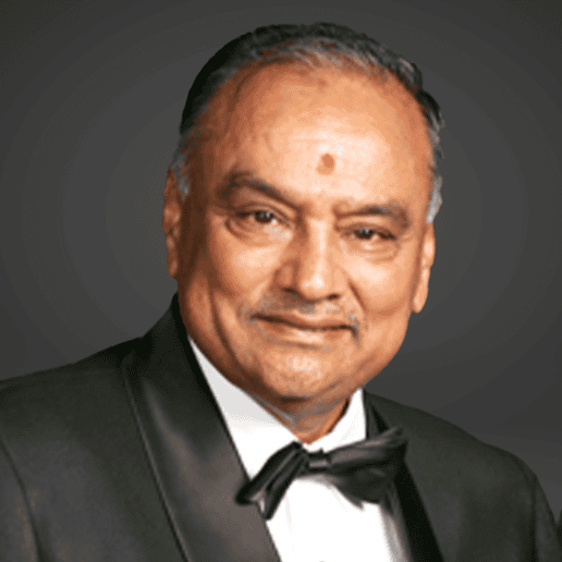 Formal close portrait of Rajnikant S. Ajmera in a black dinner jacket and bow tie